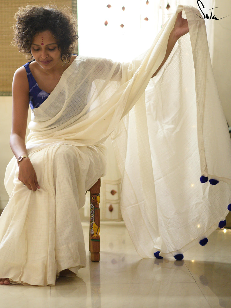 White cotton and silk threads with blue tassels