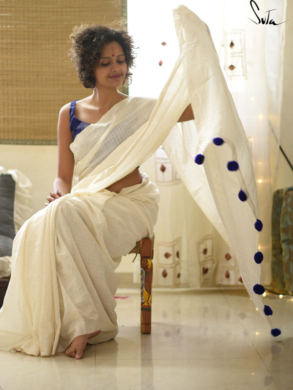White cotton and silk threads with blue tassels