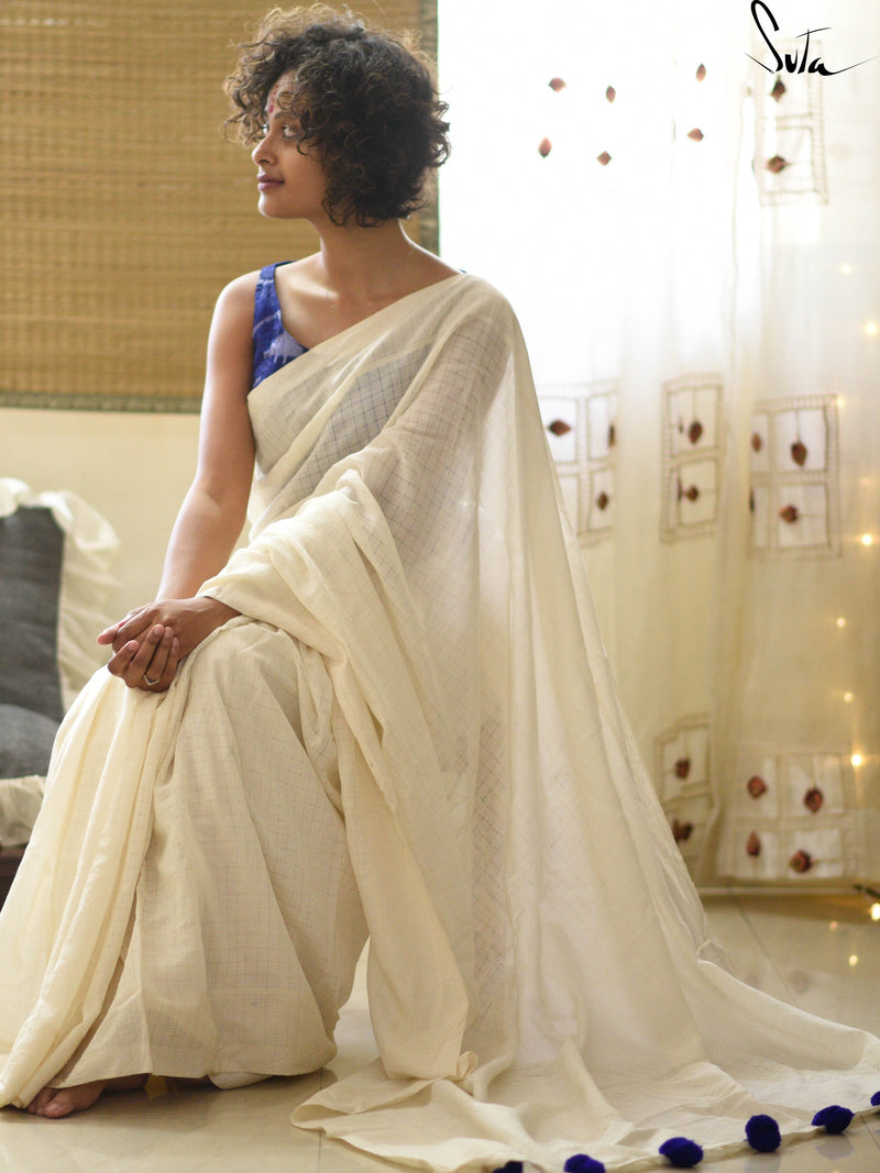 White cotton and silk threads with blue tassels