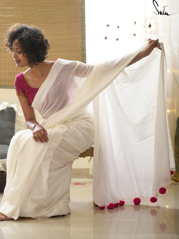 White cotton and silk threads with pink tassels