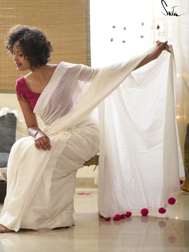 White cotton and silk threads with pink tassels