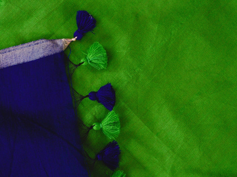 Deep blue sky and a green feather